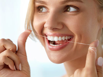 Beautiful Smiling Woman Flossing Healthy White Teeth